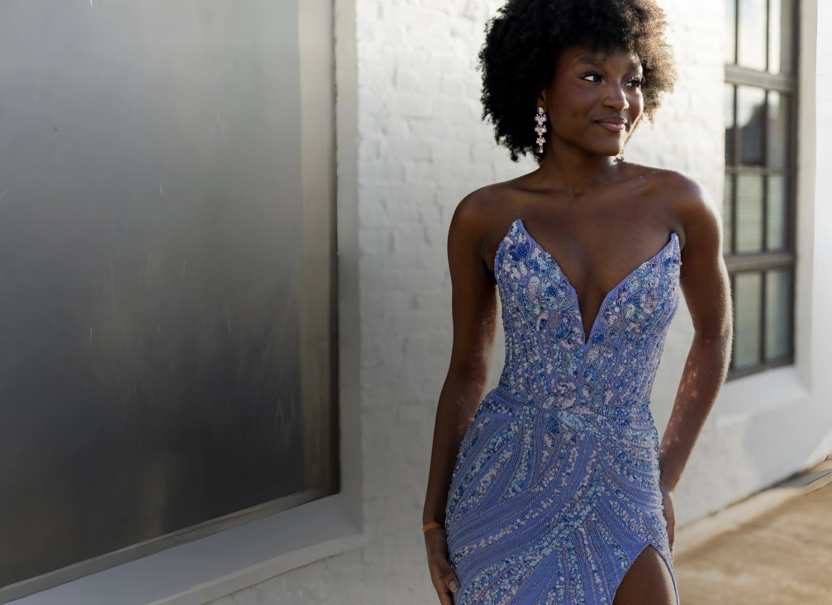 Model wearing a gold prom gown