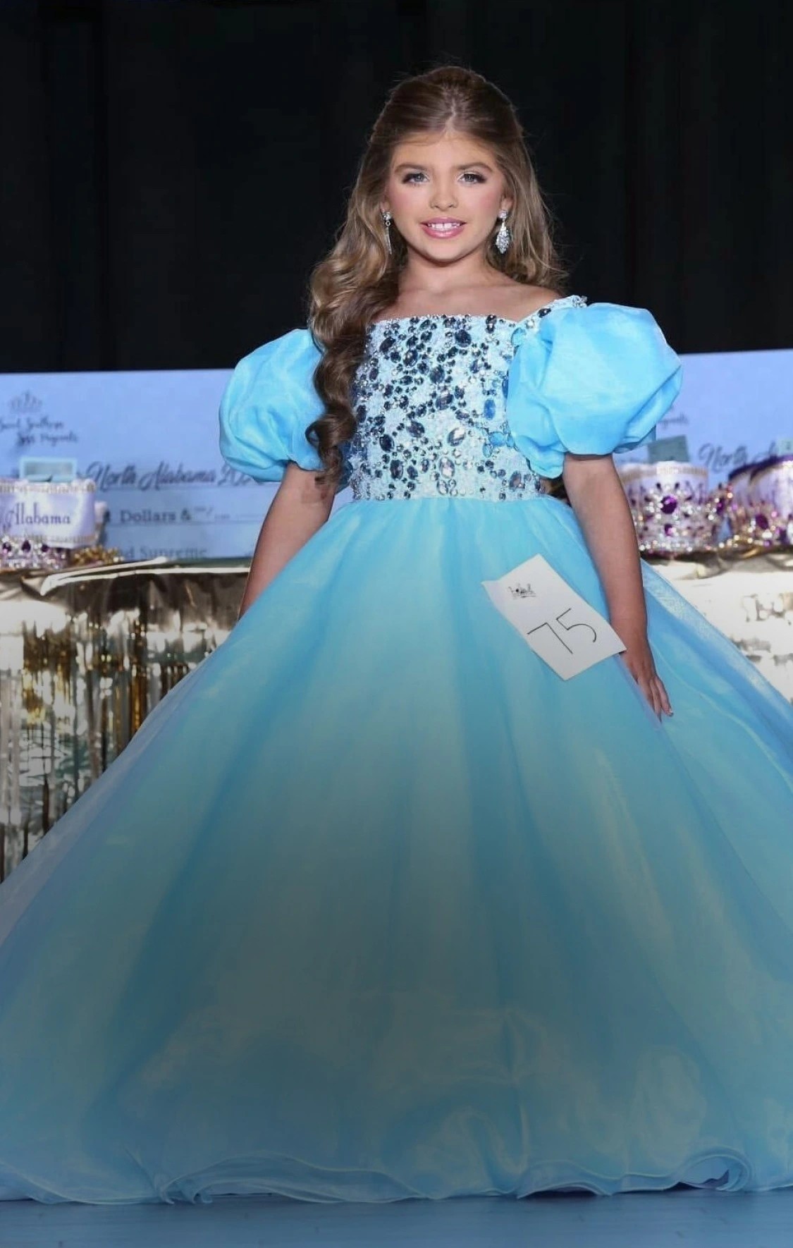 Model wearing a white gown. Mobile image